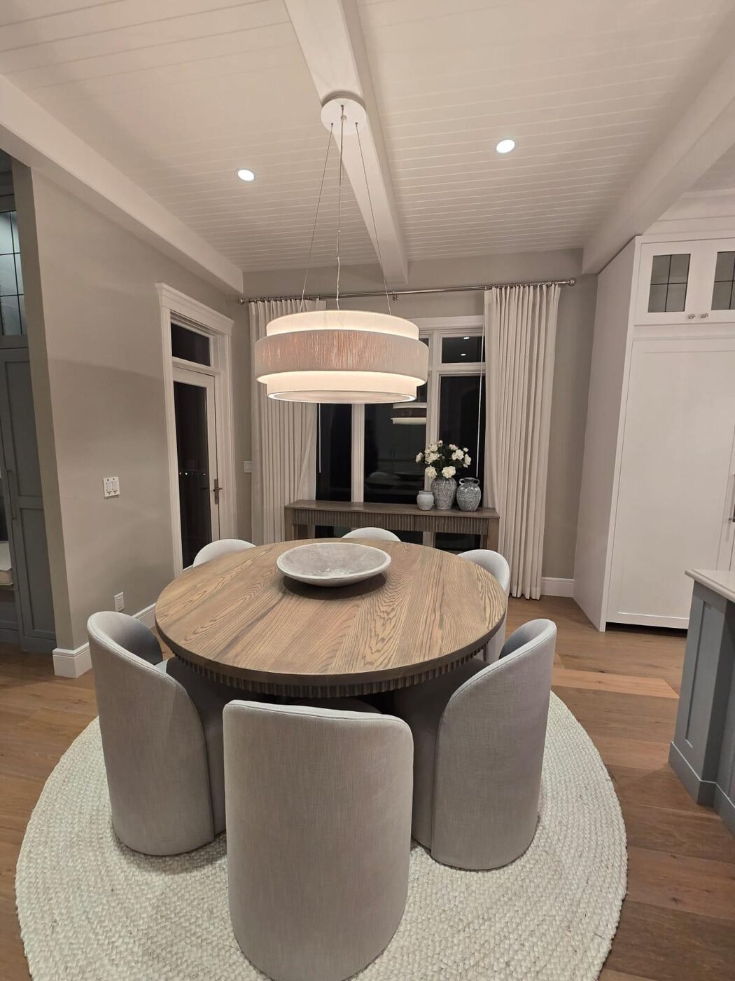 Breakfast room with round table and pendant light after a residential clean