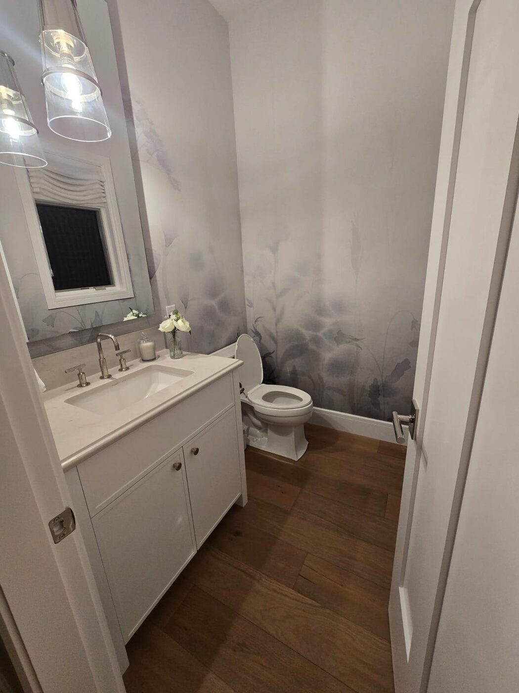 Guest bathroom vanity with polished taps and mirror after cleaning