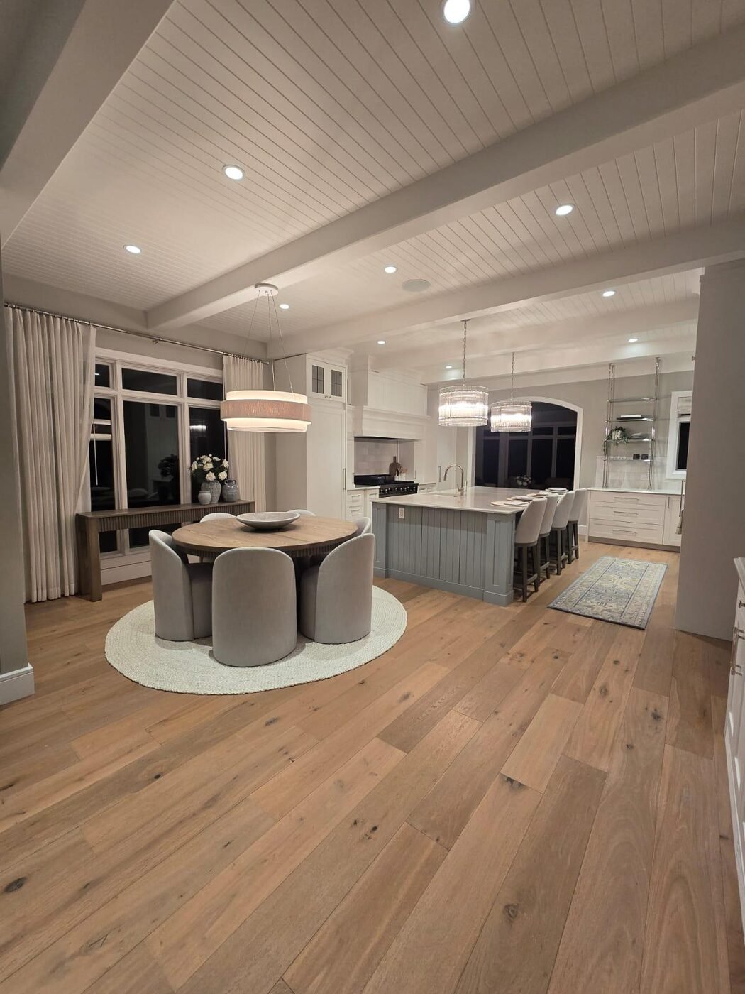 Open plan kitchen and dining area with island, floors cleaned throughout
