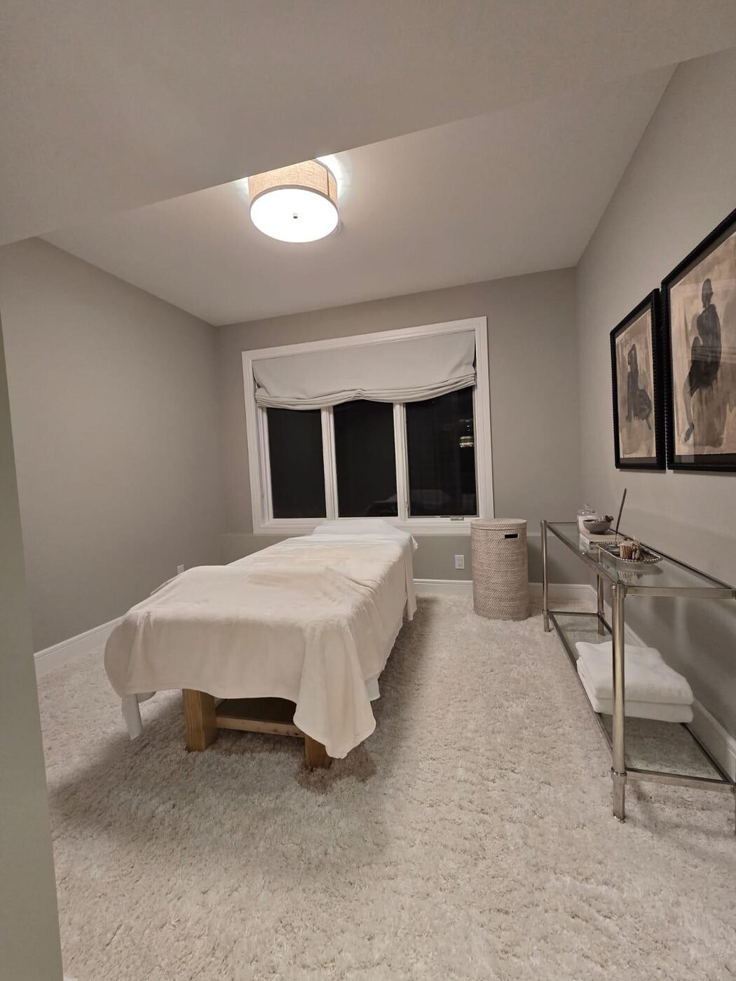Treatment room with table and carpet, fully cleaned and reset